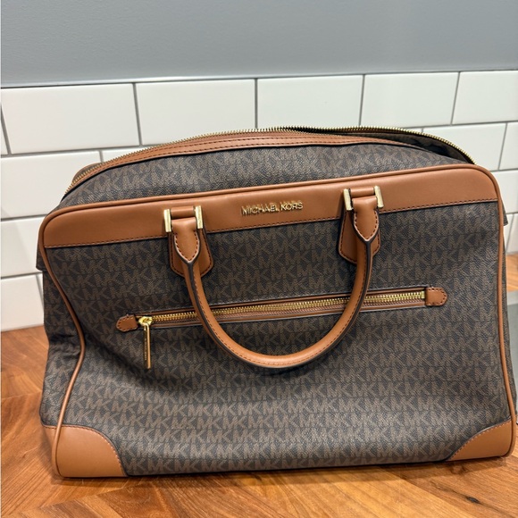 Michael Kors Signature Brown and Tan carry on bag.